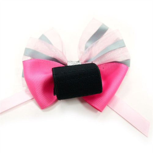 Dog bow tie with hot pink ribbed bow, pastel striped top, black backing