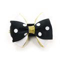 Black polka-dot dog bow tie with gold ribbon center and gold hanging threads