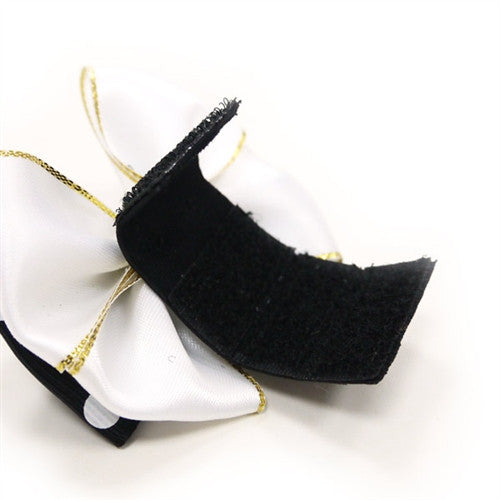 Black dog bow tie back view with gold-thread edges and hanging loops