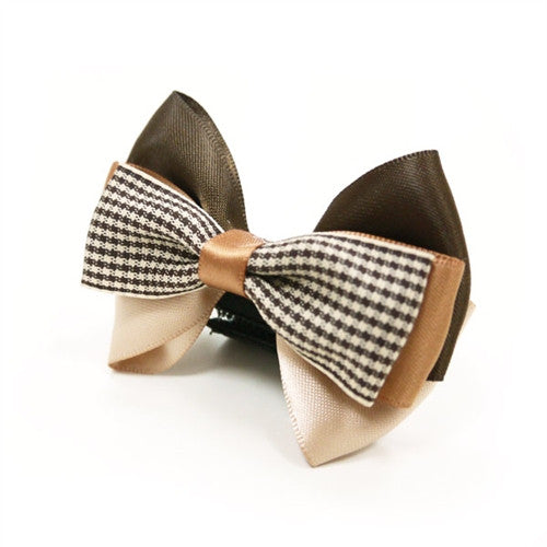 Dog bow tie: brown wings with black-and-white houndstooth panel and tan center knot