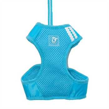 Blue soft step-in dog harness with breathable mesh design, D-ring patch, and strap.