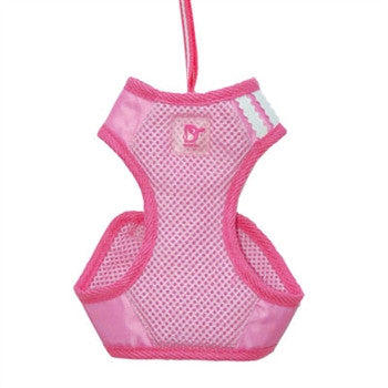 Pink soft step-in dog harness with mesh fabric, D-ring patch, and side openings.