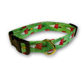 Green holiday dog collar with red tree and white star pattern, brass buckle and D-ring