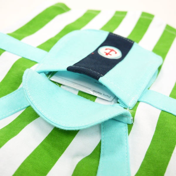 Close-up of anchor patch on dark pocket attached to light blue strap
