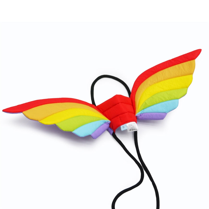 Rainbow dragon wings accessory with quilted red, yellow, green, and blue panels