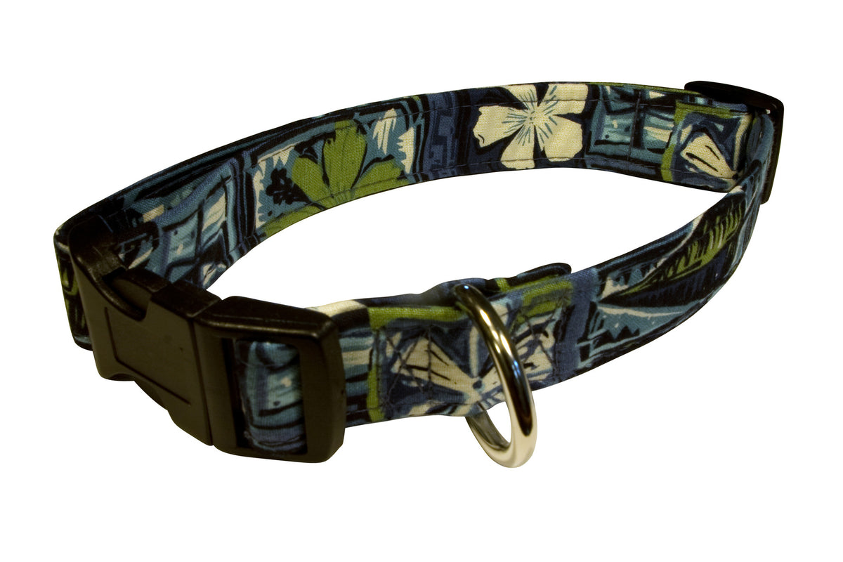 Tapa dog collar with green and blue print, black strap, and gold buckle