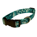 Dog collar with teal leaf pattern fabric, black buckle, gold D-ring