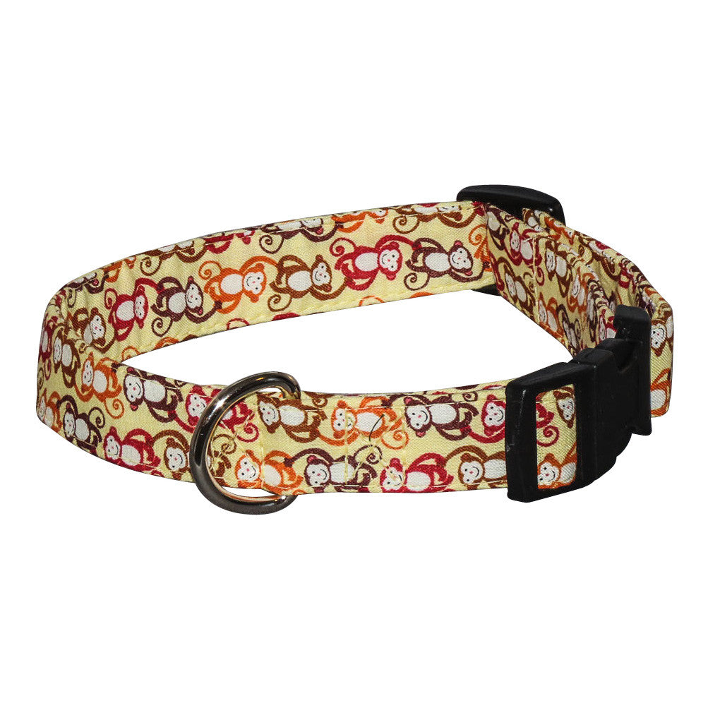 Monkey-print dog collar with red faces, black buckle and D-ring