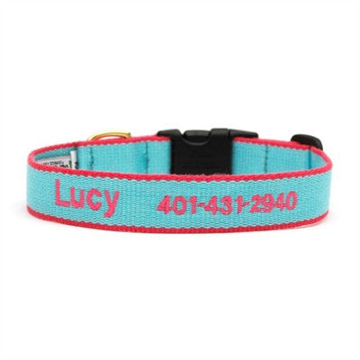 Personalized dog collar in aqua and coral with “Lucy” text and phone number