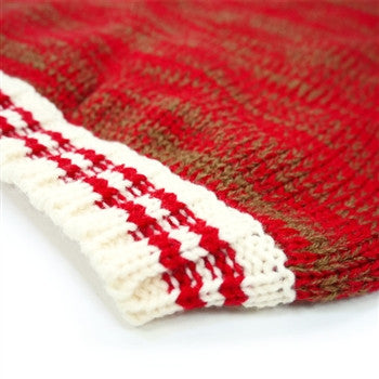 Red dog sweater close-up of white-striped cuff and ribbed edge