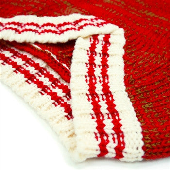Red knit dog sweater close-up of ribbed hem and white stripe trim