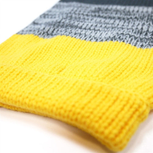 Knit cuff and hem detail on yellow dog sweater with gray band