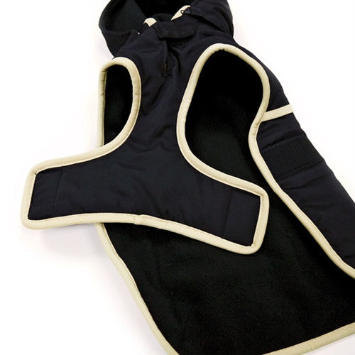 Black dog trench-style coat with hood, light contrast trim, close-up of chest panel