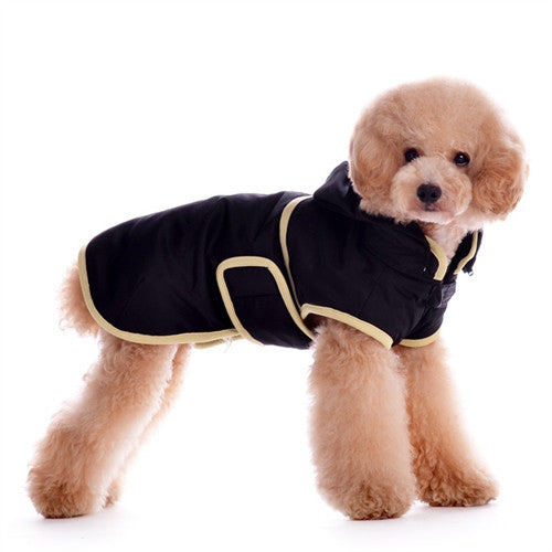 Dog trench-style coat with hood, black fabric and light trim, side view on a pet