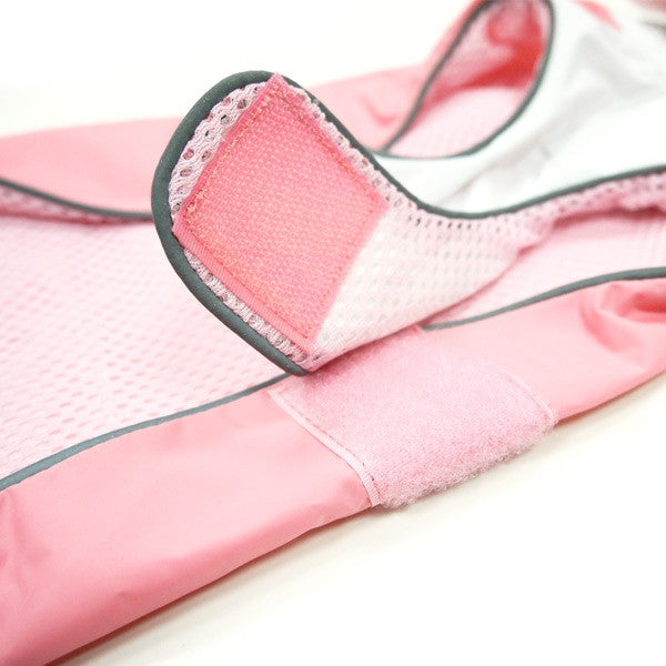 Pink dog raincoat hood with pink mesh lining and dark trim on opening
