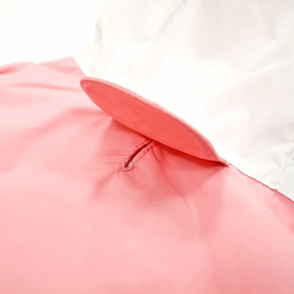 Pink dog raincoat with hood and stitched collar seam