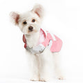 Pink and white bunny raincoat with mesh texture, worn by small white dog