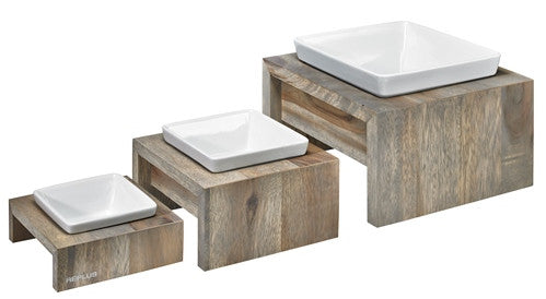 Grey rustic wood multi-level dog feeder with three white square ceramic bowls