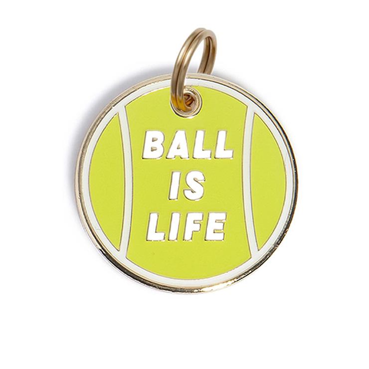 Round green dog tag front with metal hoop ring and “BALL IS LIFE” text