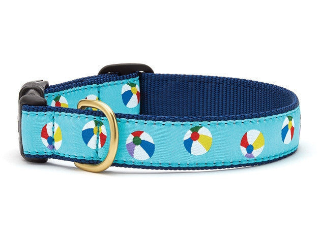 Dog collar with navy webbing, light blue beach-ball pattern, brass buckle and black loop