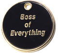 Round black dog tag with gold border and “Boss of Everything” text