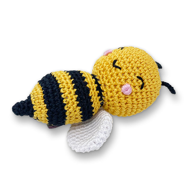 Crochet bee dog toy with curled striped body, yellow head, and white crochet wings