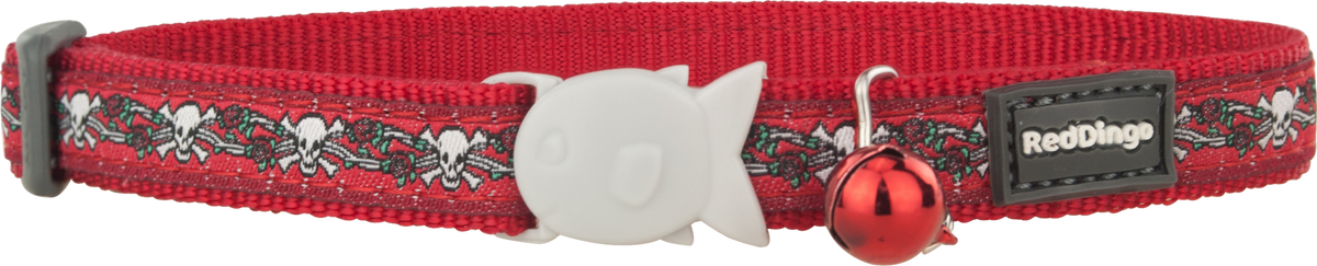 Red cat safety collar with skulls and roses pattern, white buckle, and red bell