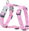 Pink patterned dog harness with gray buckles and adjustable straps