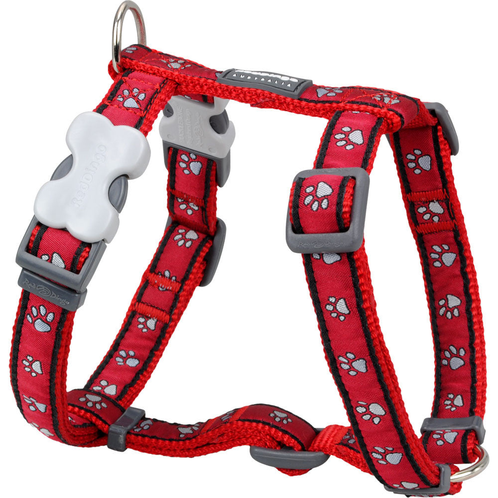 Red dog harness with pawprint pattern, padded straps and gray buckle hardware