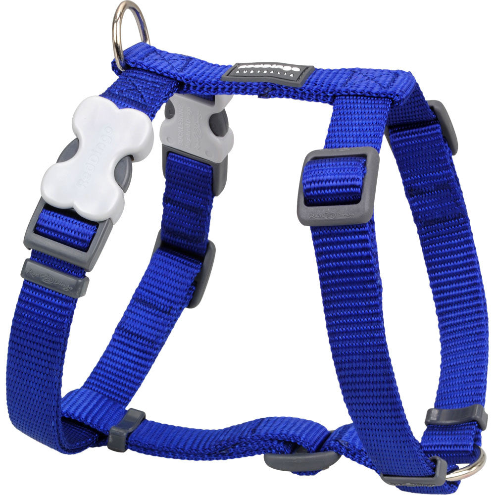 Dark blue dog harness with adjustable straps, padded chest band, and metal buckles