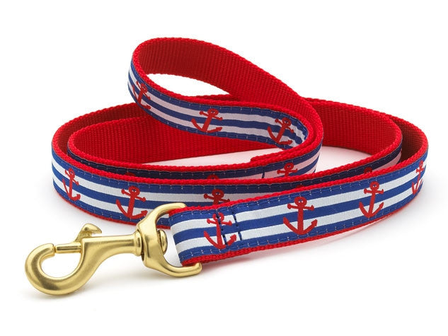 Red and blue striped dog leash with anchor pattern and gold clasp.