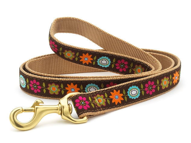 Tan floral dog leash with colorful flowers and gold metal clasp