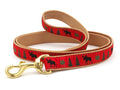 Up Country moose dog leash with red patterned webbing and brass clasp