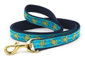 Sea turtle dog leash with turquoise webbing, navy trim, brass clip and ring.