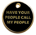 Round black dog I.D. tag with gold border and text: HAVE YOUR PEOPLE CALL