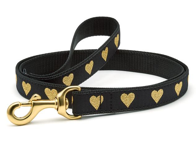 Black dog collar with gold heart pattern, gold D-ring and leash clip