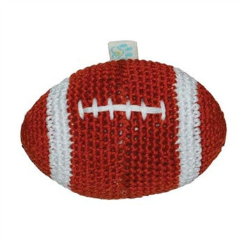 Crocheted football-shaped dog toy with dark brown body, white stripe bands, and lace stitching