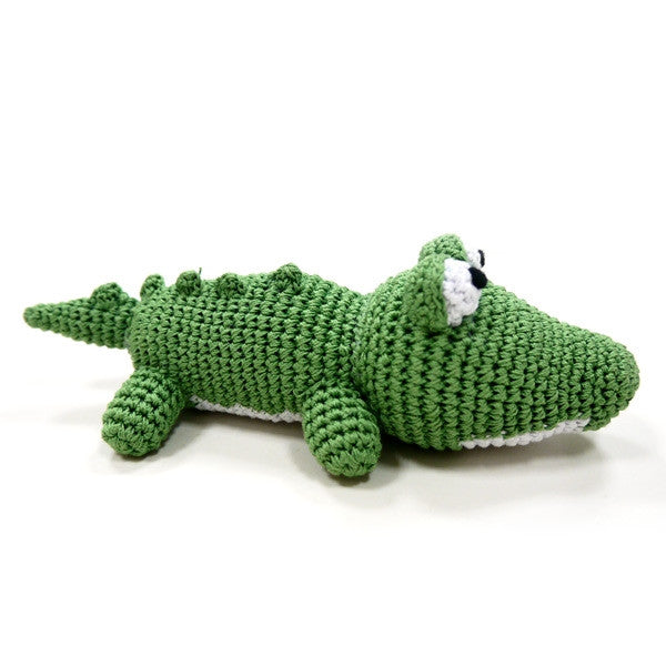 Green crocheted alligator dog toy with squeaker, side view and little tail