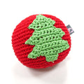 Crocheted Christmas tree ball dog toy with green tree applique and red yarn shell