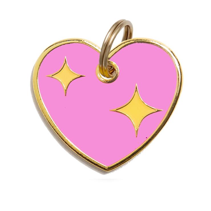 Pink heart dog tag with gold rim and two yellow star charms, hanging ring at top