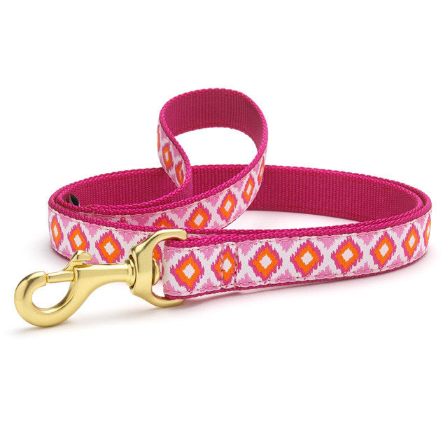 Pink dog collar with diamond-patterned band, gold D-ring, and buckle