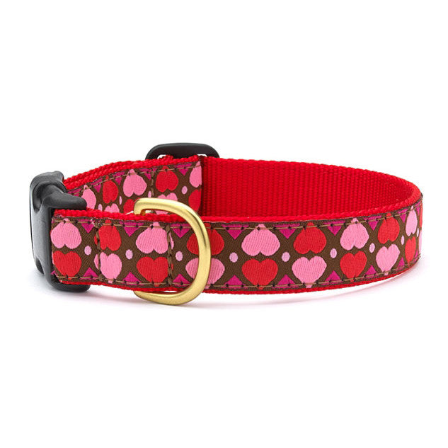 Red dog collar with pink heart pattern and black buckle, gold ring hardware