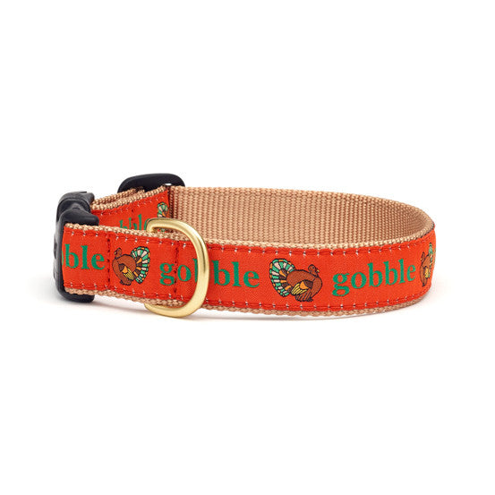 Turkey print dog collar, tan webbing with red band, brass buckle and D-ring