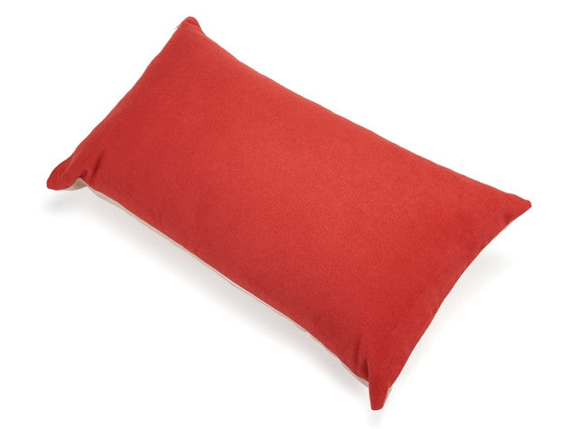 Red accent pillow with smooth solid fabric and centered edge stitching