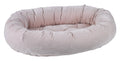 Blush microvelvet donut dog bed with raised bolsters and soft padded rim