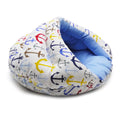 Small dog snuggle bed with blue anchor print and light blue padded inner cushion