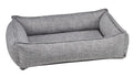 Rectangular gray fabric dog bed with raised bolsters and cushioned base