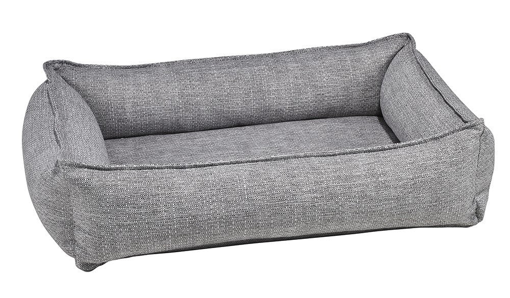Rectangular gray fabric dog bed with raised bolsters and cushioned base