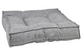 Gray microlinen dog bed with padded bolster and stitched seams
