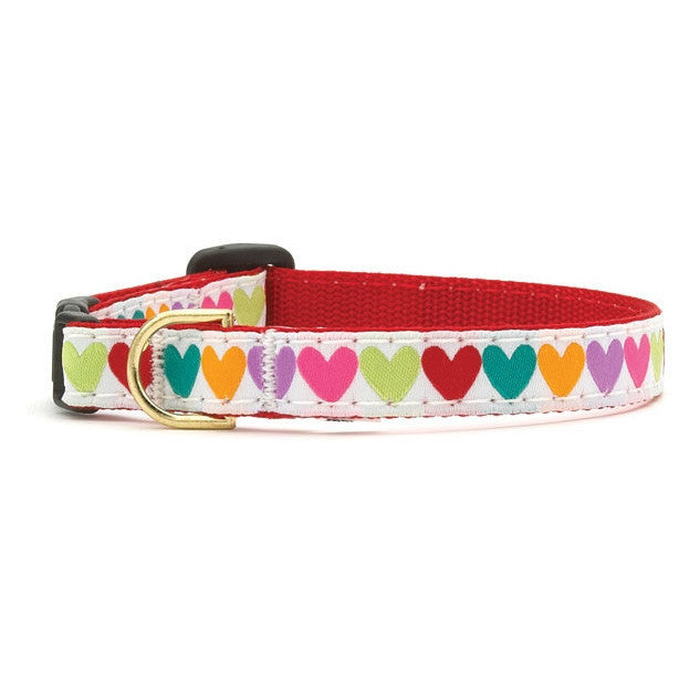 Red-and-white cat collar with colorful heart print and gold buckle